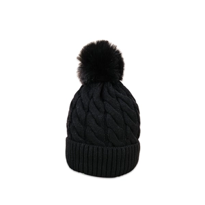 Classic black cable knit beanie for men and women with a soft fluffy faux fur pom-pom topper