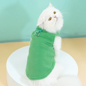 Green fleece pet vest with metal D-ring for cats and small dogs shown on a cat