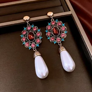 Vintage gold drop earrings with multi-colored crystals and elegant white waterdrop pearls