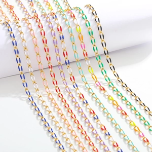 Macro detail of colorful enamel oil drop charms on 3.7mm gold stainless steel jewelry chains