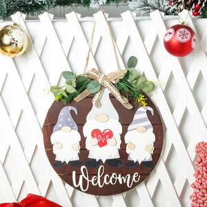 Round wooden welcome sign with festive gnomes and bows for holiday door decoration