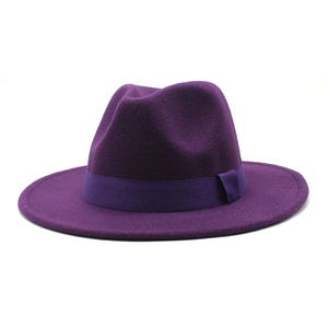 Close-up of deep purple fedora hat with matching grosgrain ribbon and classic indented crown