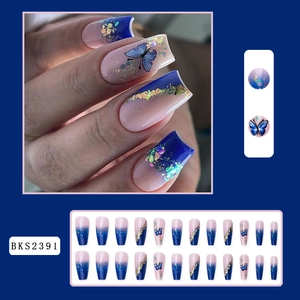 Detail of pink and blue gradient coffin press-on nails with blue butterfly and gold foil
