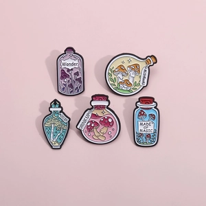 Detail view of five enamel pins featuring mushroom potion bottles with floral motifs