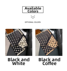 Detail of polka dot scarves in black-white and black-coffee with luxury accessories