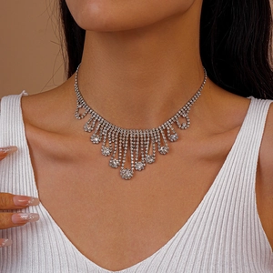 Close-up of sparkling silver tassel choker necklace with diamond-like rhinestones