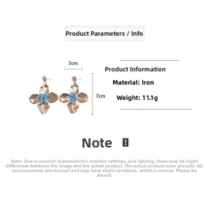 Detailed size specifications for gold matte floral earrings with blue stamen detail