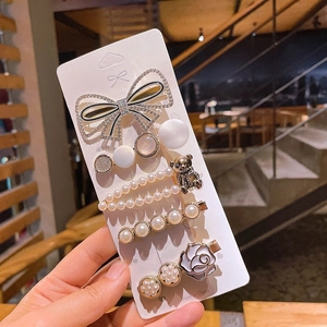 Detail of 5-piece Korean hair clip set with pearl bear, rhinestones and rose flower