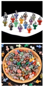 Close-up of assorted natural crystal and amethyst mushroom pendants in various colors