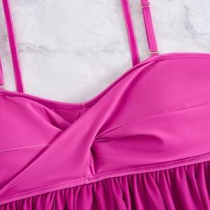 Detail of rose pink tankini with twisted bust design and adjustable shoulder straps