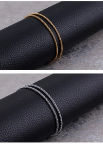 Detail of 2mm titanium steel corn chain in gold and silver finishes with woven texture