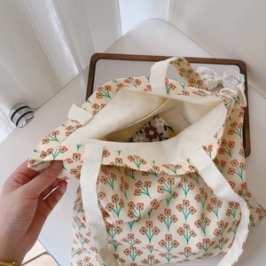 Detail shot of the floral cotton shoulder bag interior with an embroidered inner pocket