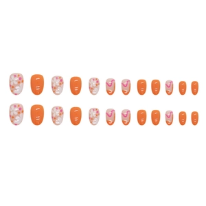 Short oval press-on nails with bright orange floral patterns and gold foil accents