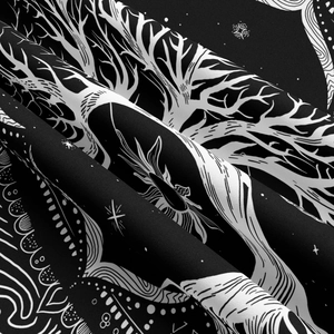 Close-up of black and white tree of life tapestry showing soft polyester fabric texture