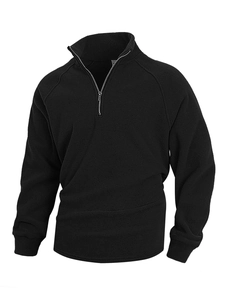 Detailed close-up of soft coral fleece fabric and stand collar with 1/4 zip on men pullover