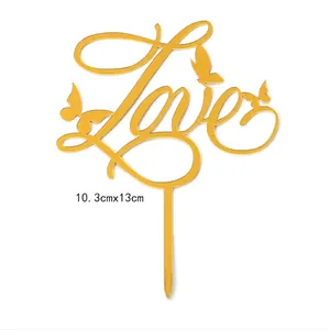 Detailed view of gold acrylic Love cake topper with butterfly accents 10.3cm x 13cm