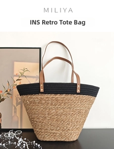Close-up of contrast woven tote bag showing reinforced leather handles and rivet details
