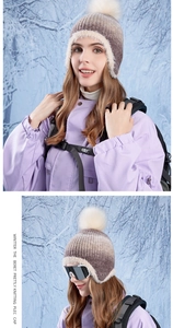 Detail of winter knitted hat with faux fur lining and gradient color for ear protection