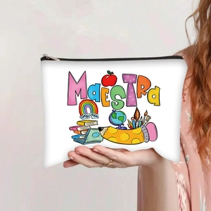 Detail of white canvas makeup bag featuring colorful Maestra teacher theme print