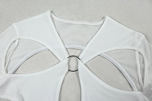 Detail of white mesh cutout top with metal ring connector and long sleeve design