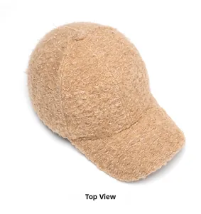 Top view of a beige faux lamb wool baseball cap showing its curly plush texture