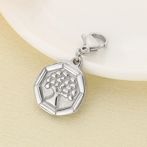 Macro detail of silver octagonal tree of life pendant with polished finish and lobster clasp