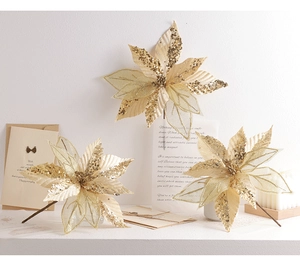 Close-up of three champagne gold sequined poinsettia artificial flowers for tree decor
