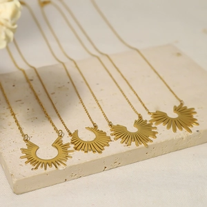 Minimalist 18K gold plated stainless steel sunburst pendant necklaces on stone