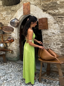 Sexy fruit green backless halter maxi dress with brown leather tote bag for vacation