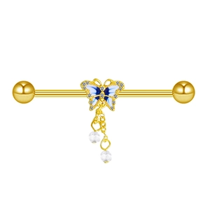Detail of a golden industrial barbell with blue butterfly and hanging beads