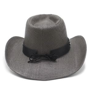 Detail of dark gray western cowboy straw hat with leather band and metal studs