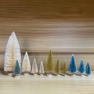 Miniature colorful bottle brush Christmas trees with wooden bases in various sizes