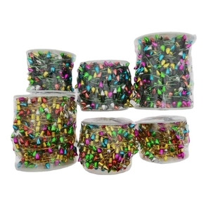 Detail of colorful water-drop bead garlands on transparent reels for Christmas decor