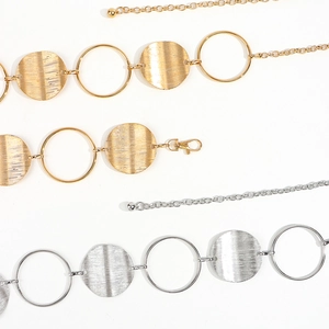 Sexy gold and silver metal body chain featuring textured geometric circles for women