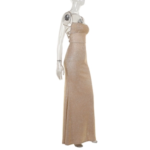 Detail of elegant gold glitter backless evening dress with delicate criss-cross straps
