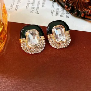 Vintage oval enamel earrings with large rectangular crystal and rhinestone gold details