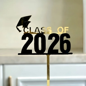 Acrylic Class of 2026 graduation cake topper with black and gold mortarboard design
