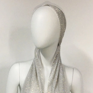 Close-up detail of silver rhinestone mesh turban hat with sparkling crystal embellishments