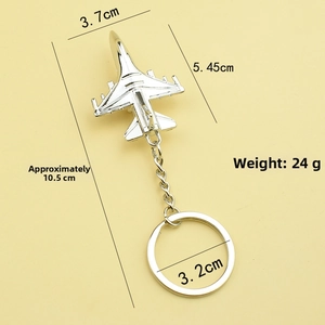 Silver fighter jet keychain detail with dimensions 10.5cm and weight 24g shown on a beige background