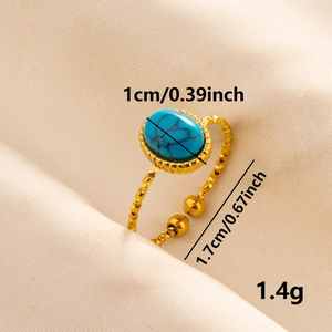 Gold plated stainless steel open ring featuring a blue stone with marble texture