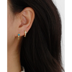 Classic gold S925 silver hoop earrings with blue and white opal stones on model