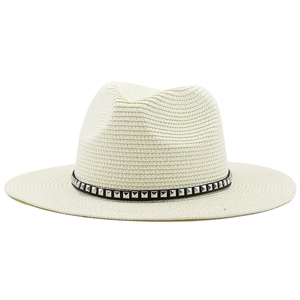 Creamy white western straw cowboy hat with black studded belt band and wide brim