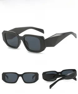Detailed views of black square geometric sunglasses with thick frames and angular cut edges