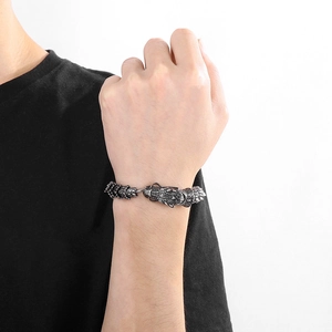 Close-up of vintage 304 stainless steel dragon head bracelet with scale pattern