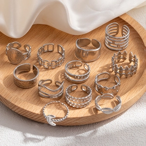 Silver retro multilayer rings set with crown and coin carving on wood tray