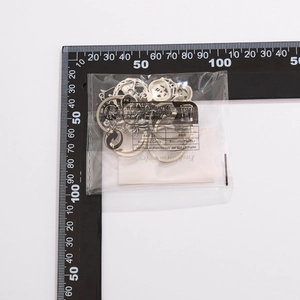 Bulk silver metal rings for jewelry making with ruler for size reference and scale