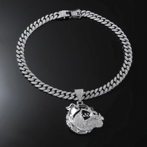 Macro shot of silver Cuban chain with diamond bulldog pendant in hip hop style