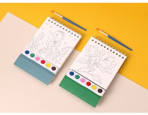 Detail of spiral-bound watercolor book with built-in six-color paint palette and brush