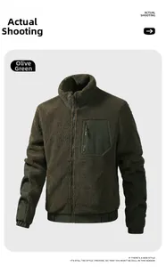 Detail of emerald green fleece jacket featuring stand collar and contrast zip chest pocket