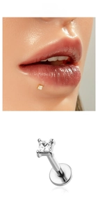 Close-up of square zircon labret stud in gold and silver stainless steel finishes